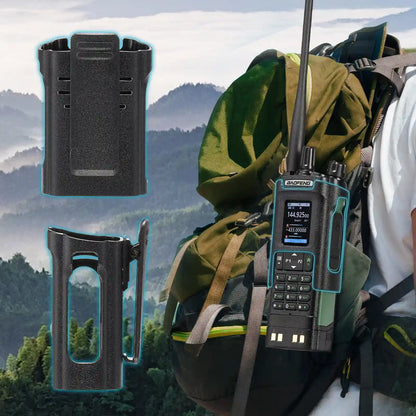 Rugged communication device with battery pack and mount on a backpack against a mountainous background