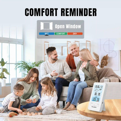 Family in a living room with a comfort reminder device on a table.