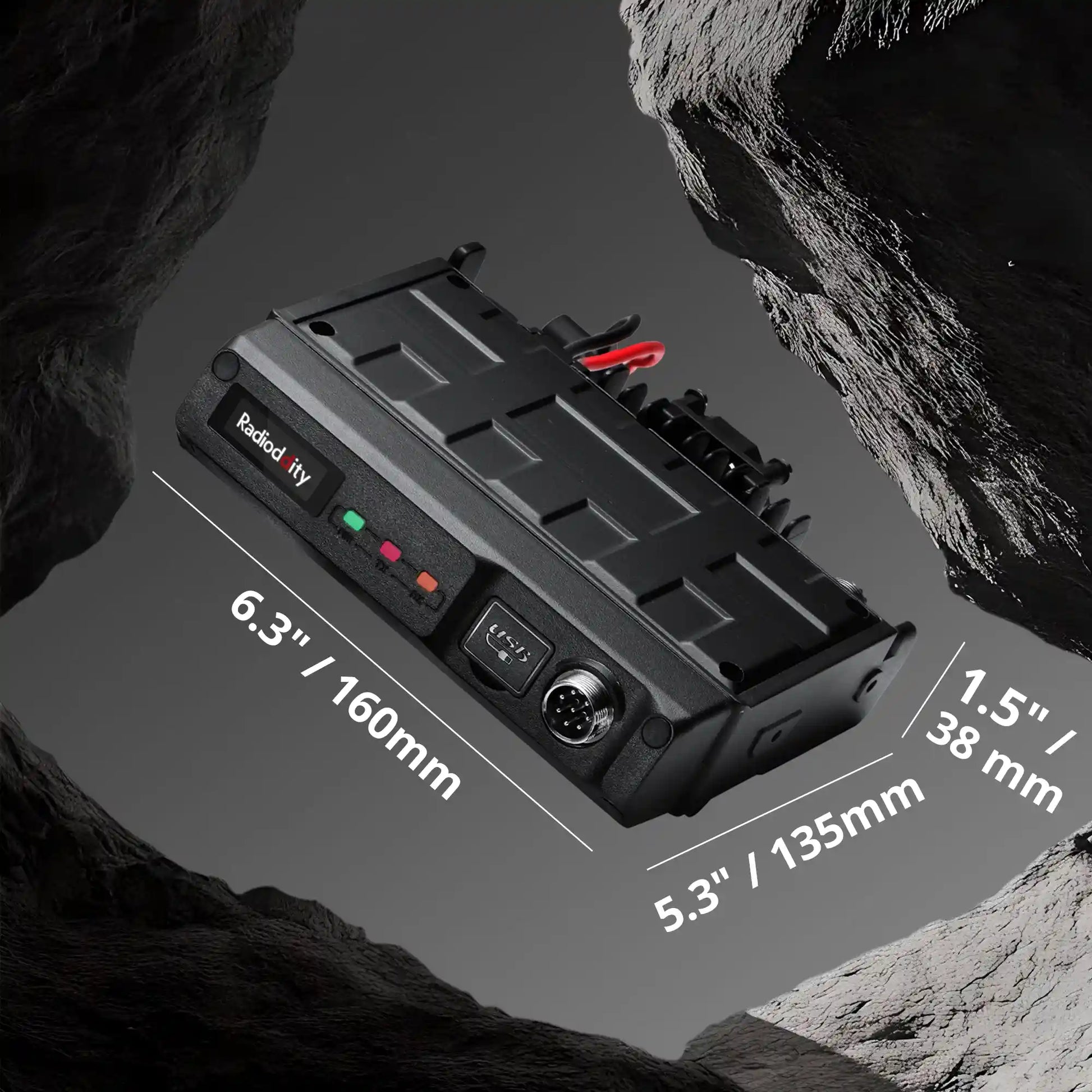 Black battery pack with dimensions labeled on a rocky background