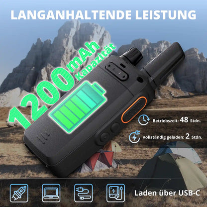 Black Echo-DE/IT  electronic device with battery indicator against a mountainous background